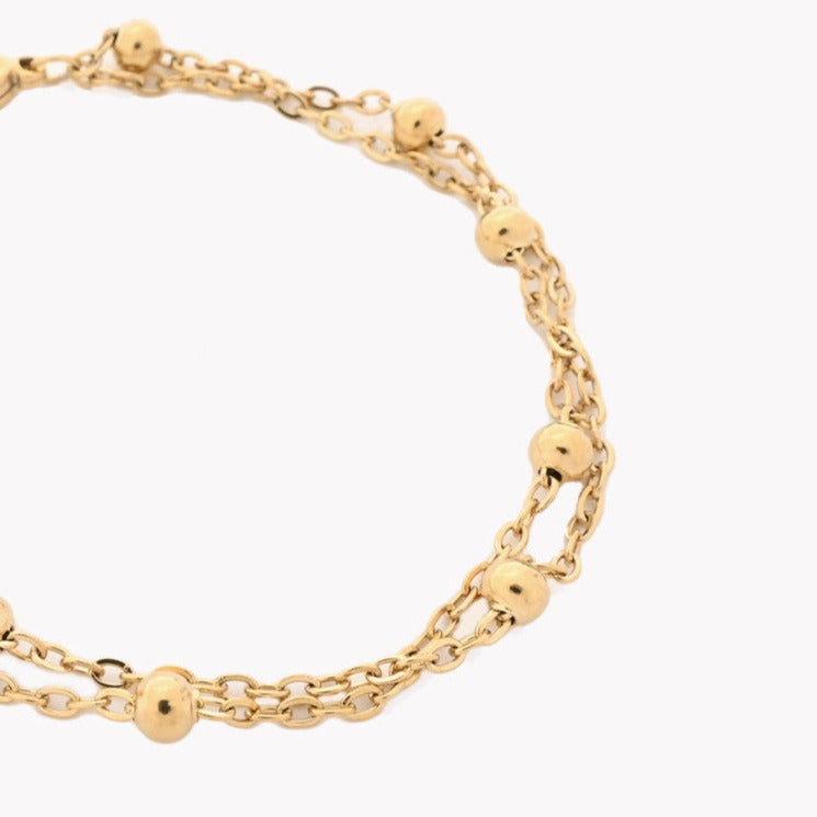 Bracelet maille double boules dorées