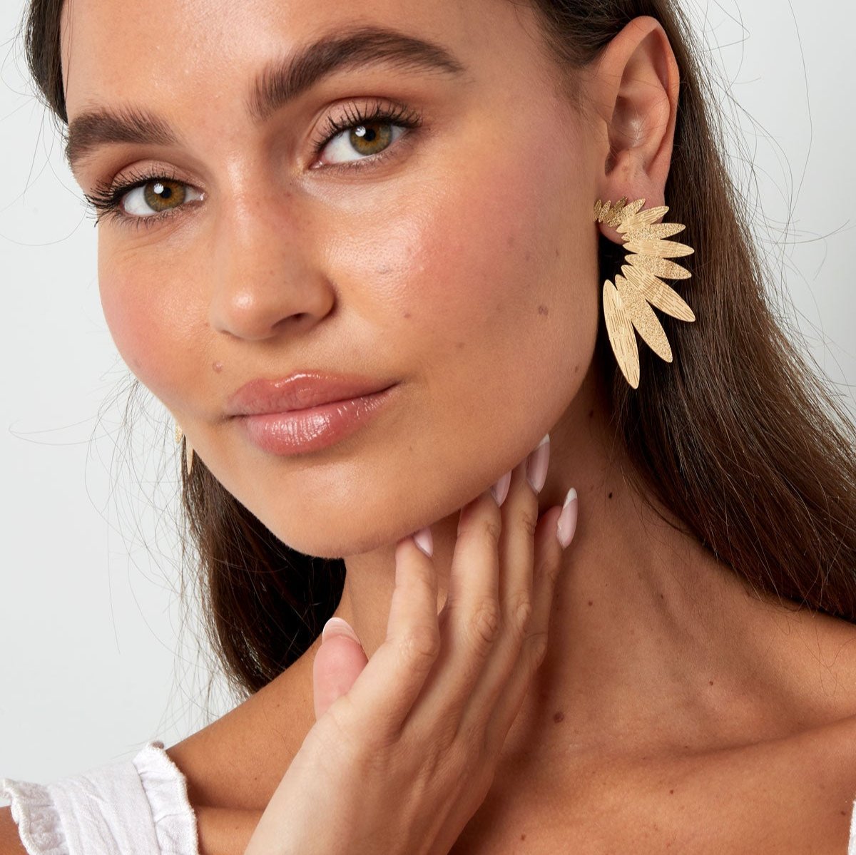 Pendientes largos hojas aladas dorados