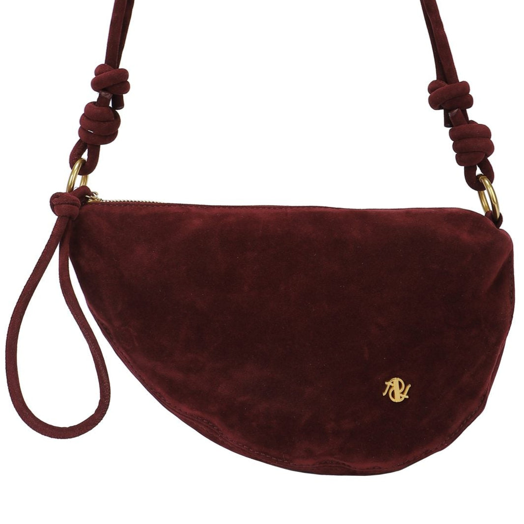 Bolso tipo bandolera media luna ligero efecto piel de ante color burdeos - mbyou