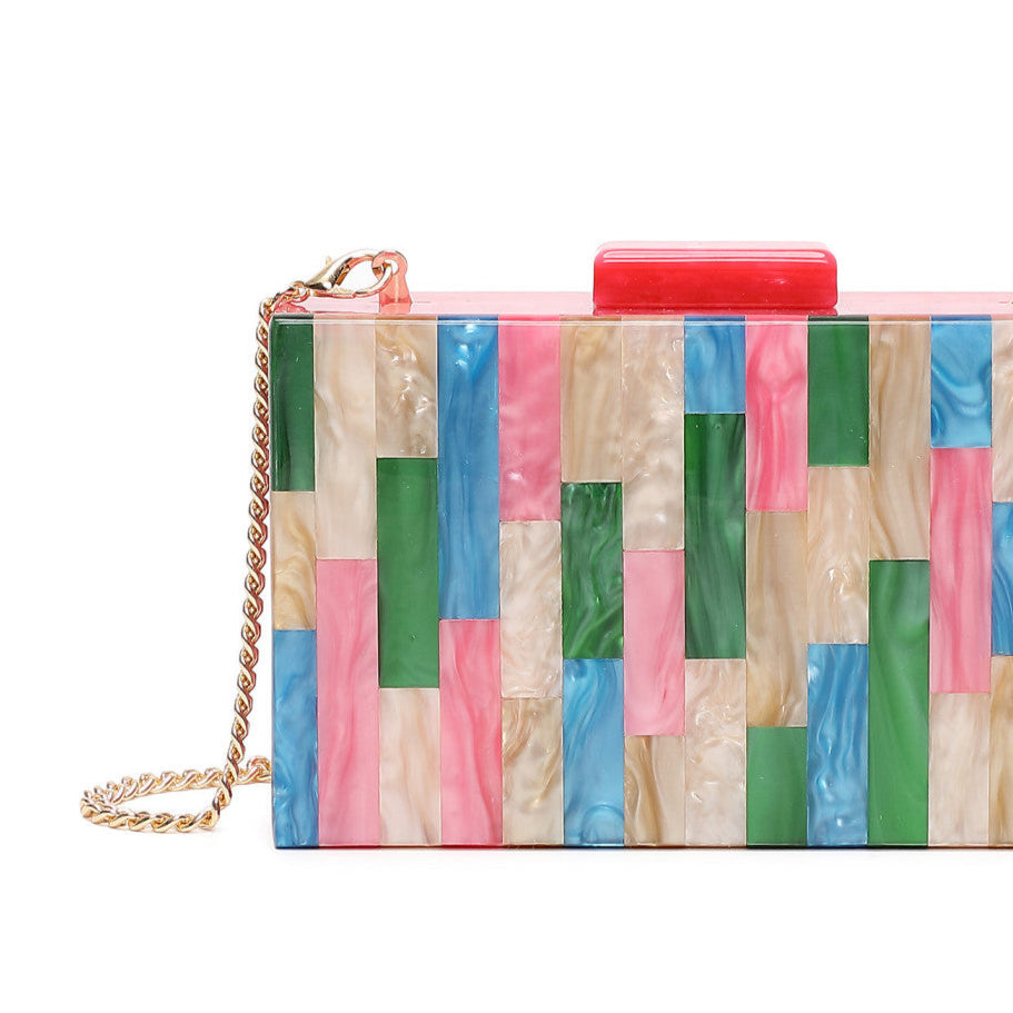 Bolso de mano de fiesta tipo clutch con motivos geométricos rectangulares en colores rosa, verde, azul y beige - mbyou