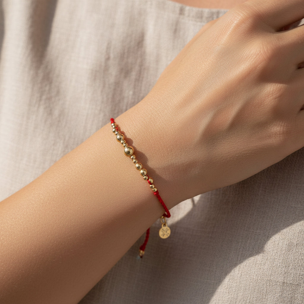 Pulsera de cuerda y acero quirúrgico casual en color rojo y dorado - Moments by You