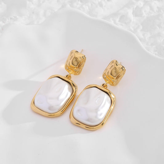 Golden pearl steel earrings