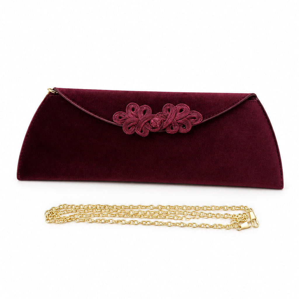 Bolso fiesta de terciopelo alargado con detalle floral trenzado
