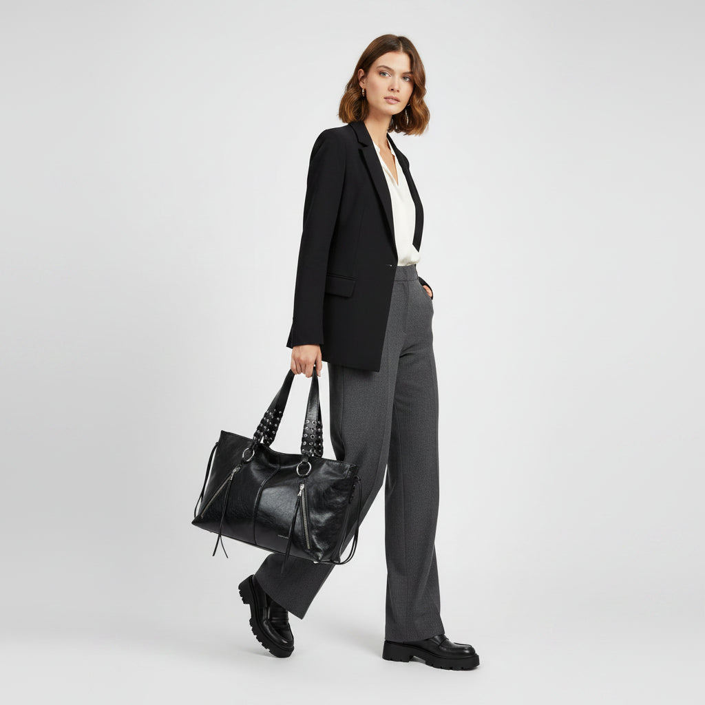 Bolso de hombro con cremalleras y diseño trenzado en color negro y plata