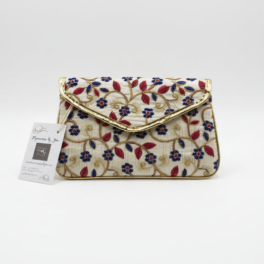 Bolso fiesta tipo sobre con estampado floral y bordeado dorado - Moments by You