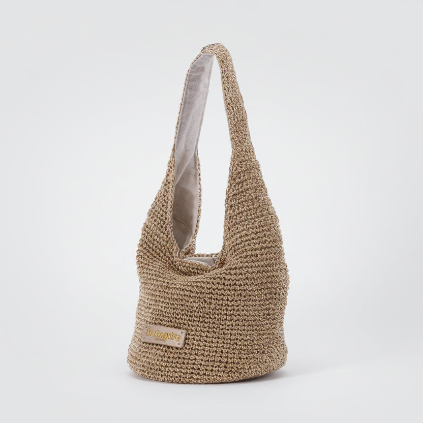 Bolso de mano tipo bucket de fibras 100% naturales en dorado brillante - Moments by You
