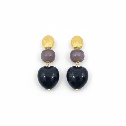 Pendientes largos de acero de diferentes formas y texturas en negro y oro