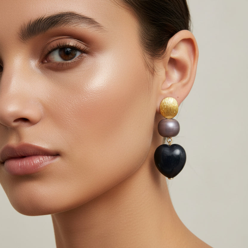 Pendientes largos de acero de diferentes formas y texturas en negro y oro