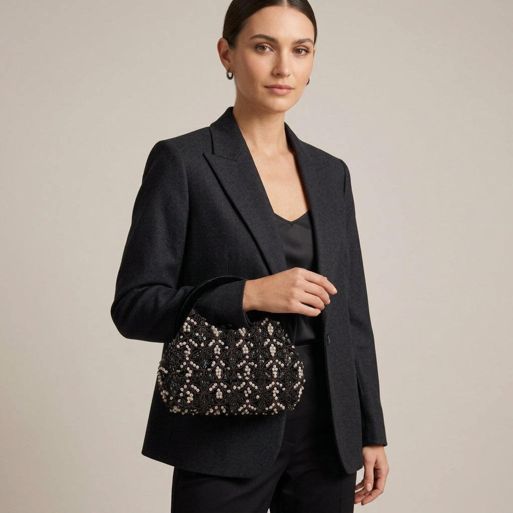 Bolso fiesta clutch ovalado de terciopelo con lentejuelas y patrón en negro