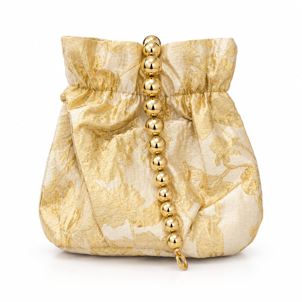 Bolso de fiesta limosnera con flores combinadas con dorado