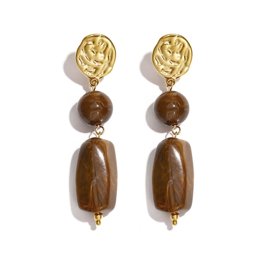 Pendientes largos acero base rugosa en oro y cuerpo en chocolate