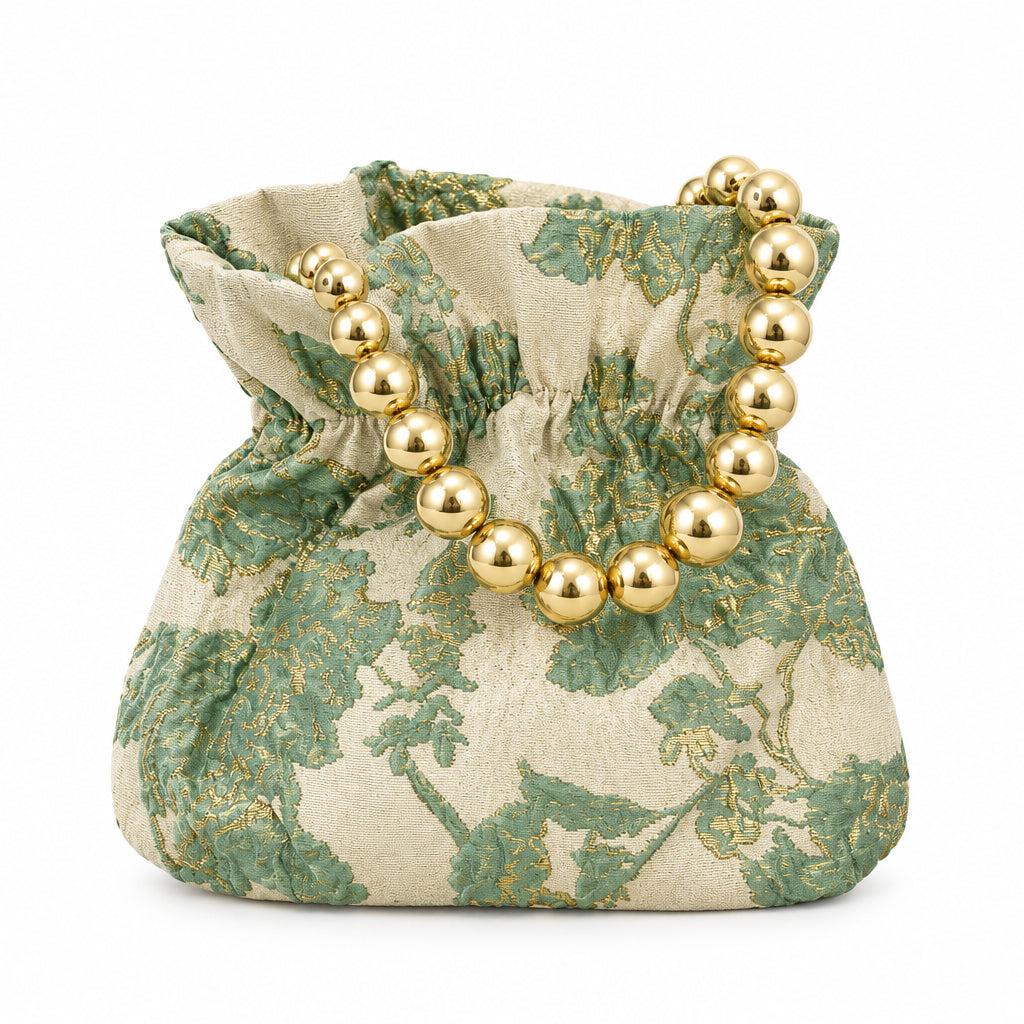 Bolso de fiesta limosnera con flores combinadas con dorado