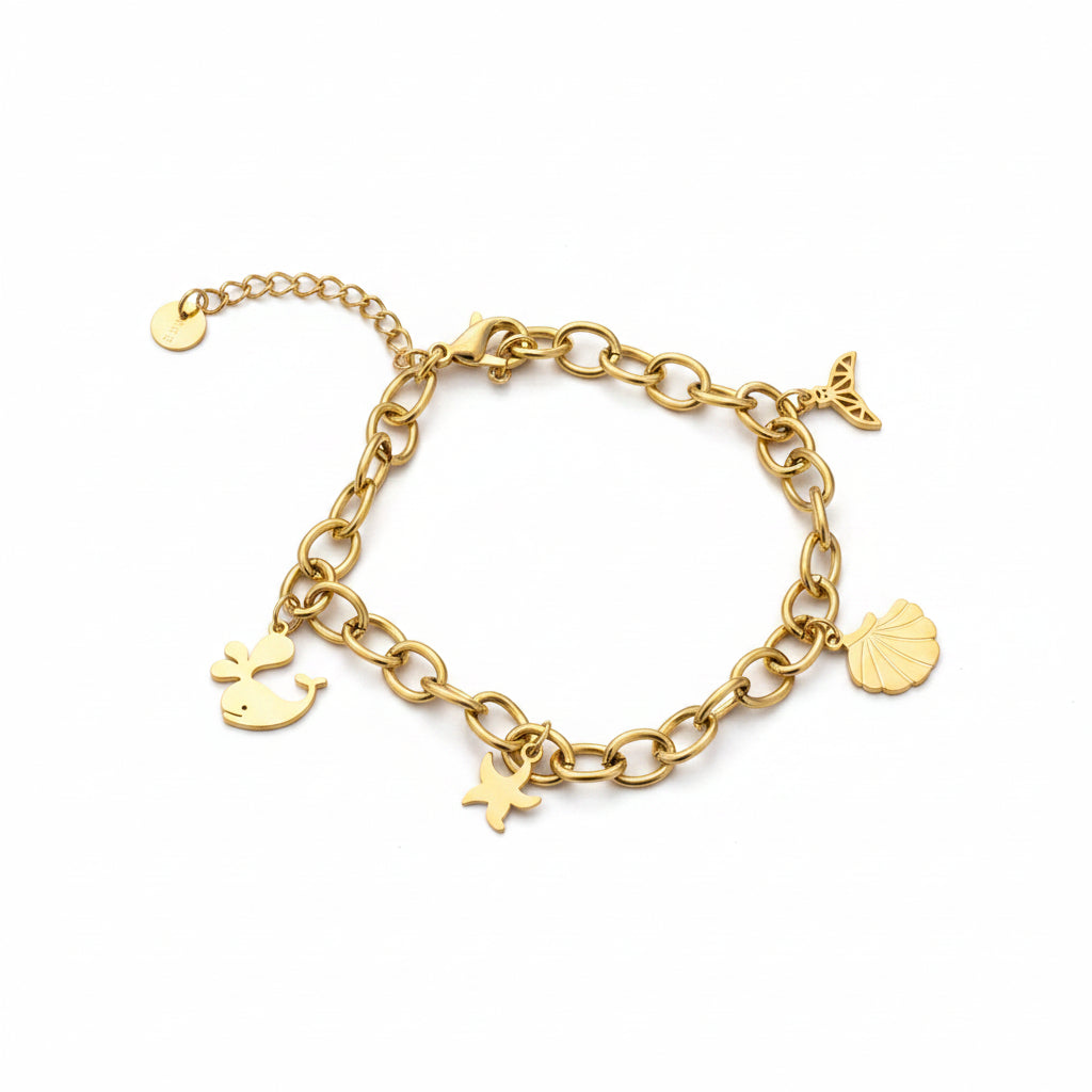 Pulsera de acero con cadena de eslabones y dijes marinos en acabado oro