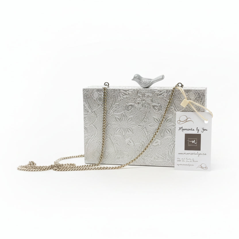 Bolso clutch de fiesta con estampado floral y figura de ave en acabado plata - Moments by You