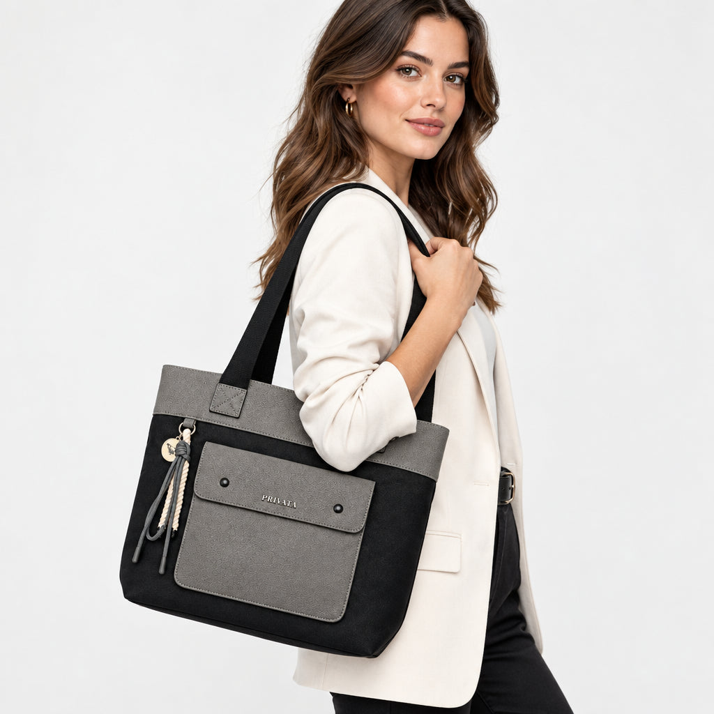 Bolso shopper negro y gris con bolsillo delantero y llavero colgante