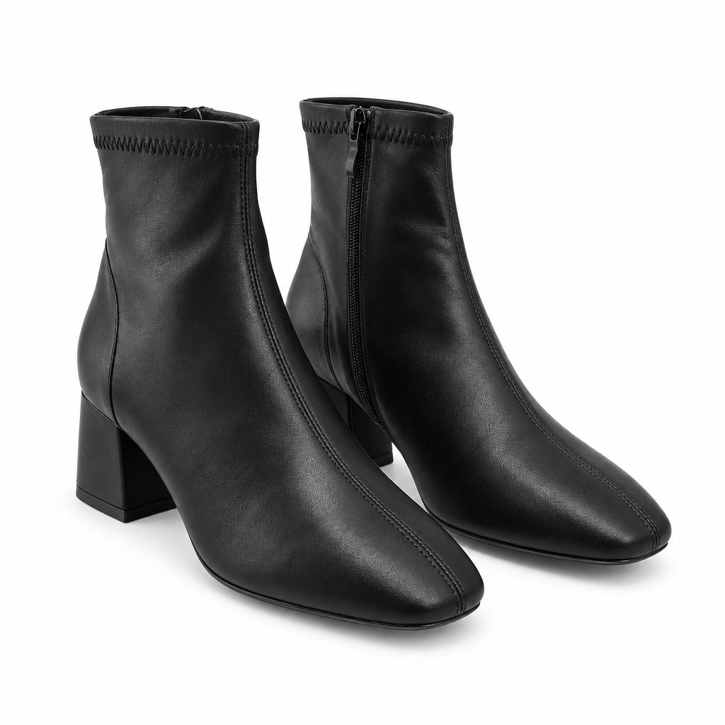 Botines de tacón acabado cuero en negro y punta redonda