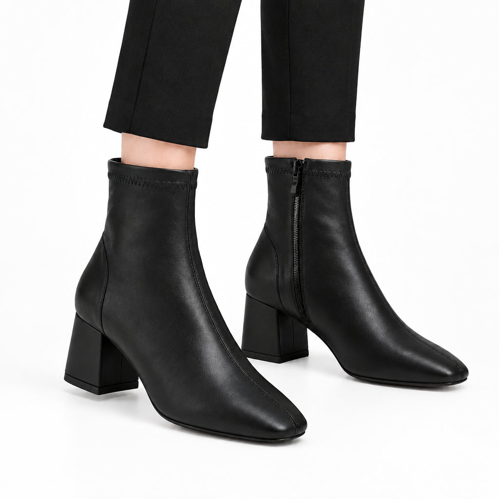 Botines de tacón acabado cuero en negro y punta redonda