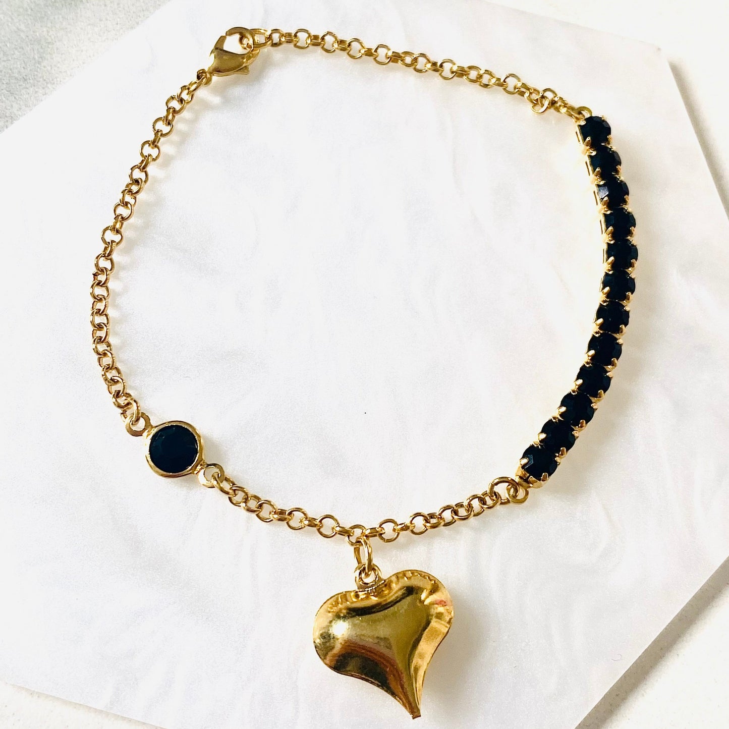 Pulsera circonitas negras baño de oro 18Kt.