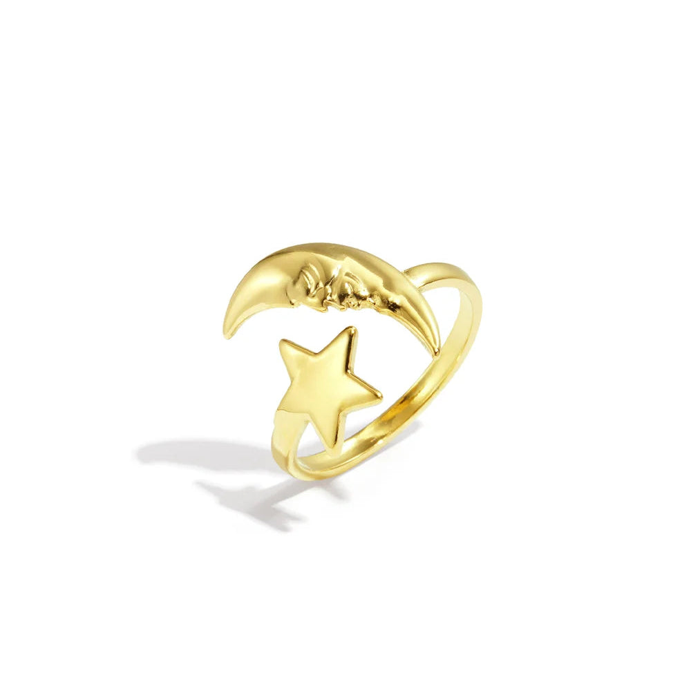 Anillo de acero con apertura separada por una luna y una estrella acabado oro - Moments by You