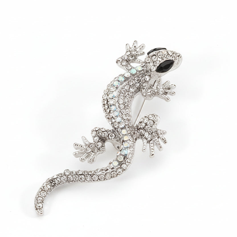 Broche en forma de lagartija en color blanco, ojos negros y acabado plata