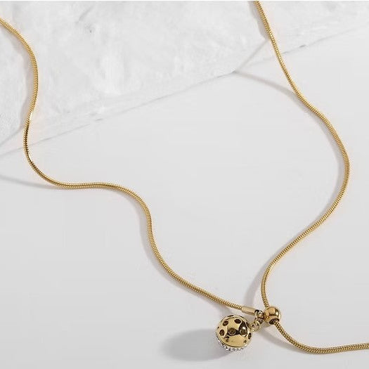 Collar de acero ajustable con dije esférico con circonitas acabado oro - Moments by You