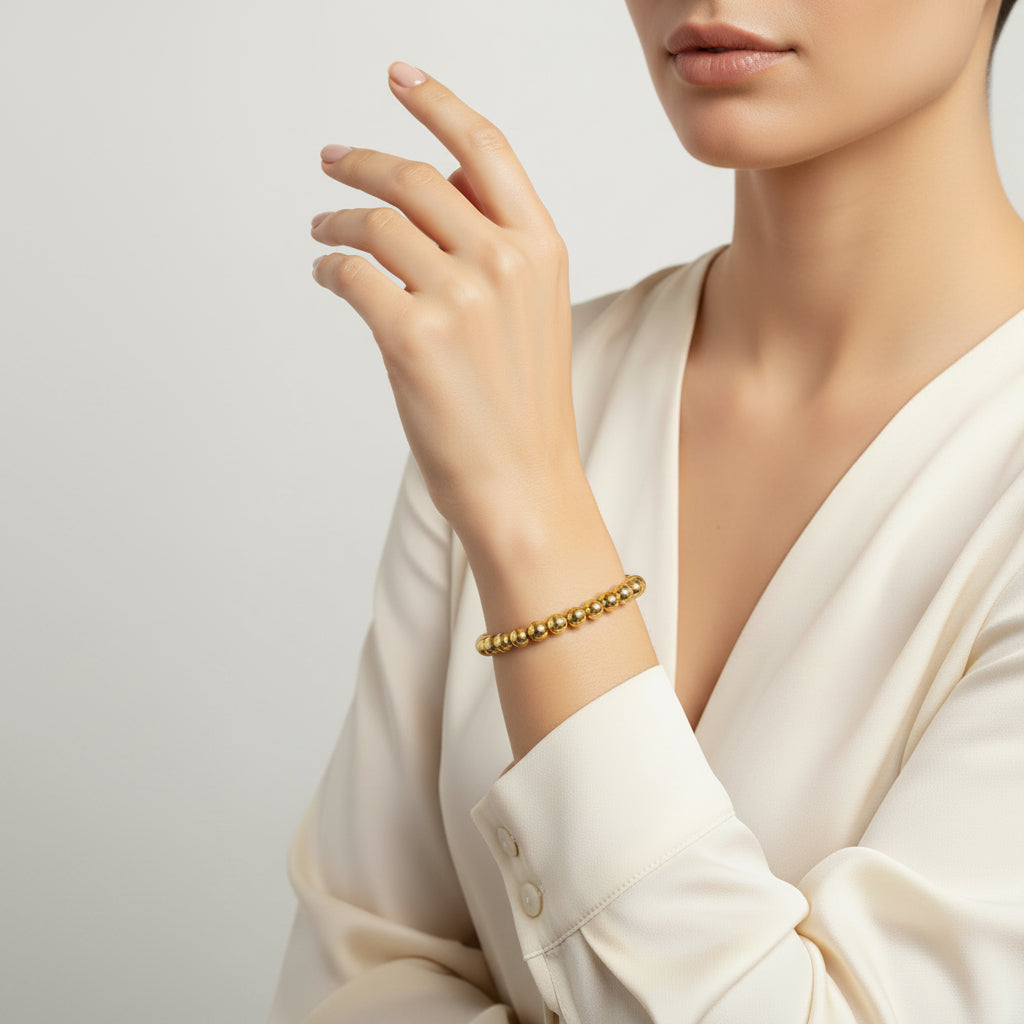 Pulsera de acero inoxidable de cuentas con forma esférica en acabado oro - Moments by You