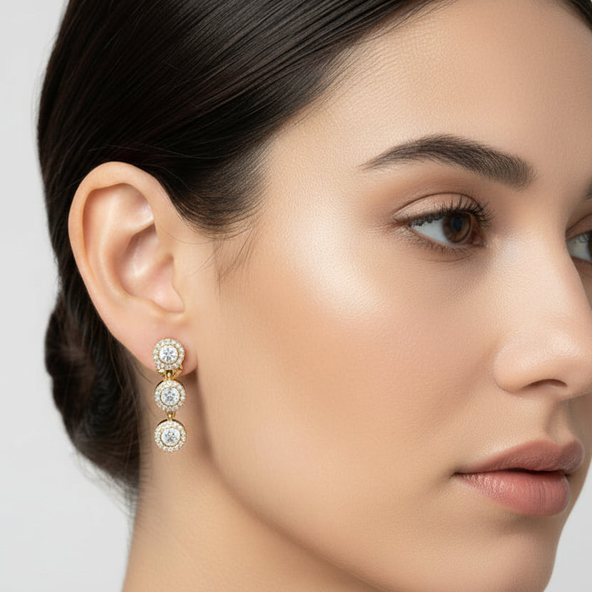 Pendientes de acero colgantes redondos con circonitas y acabado oro