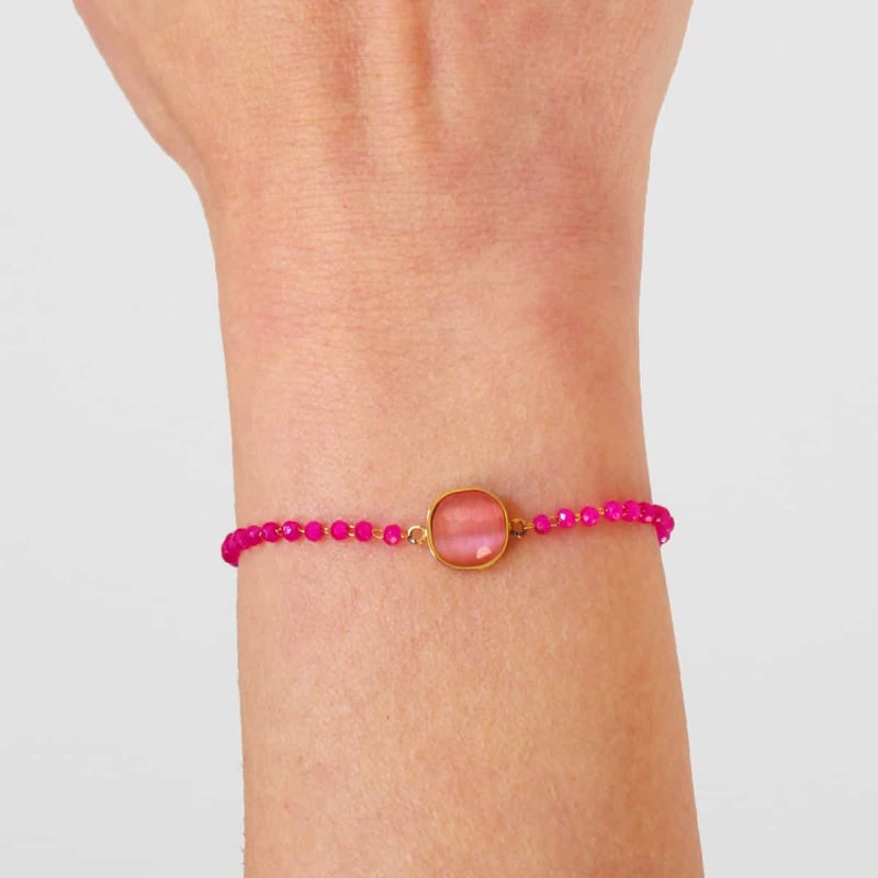 Pulseras de acero con piedra central rosa y fucsias en acabado oro - Moments by You