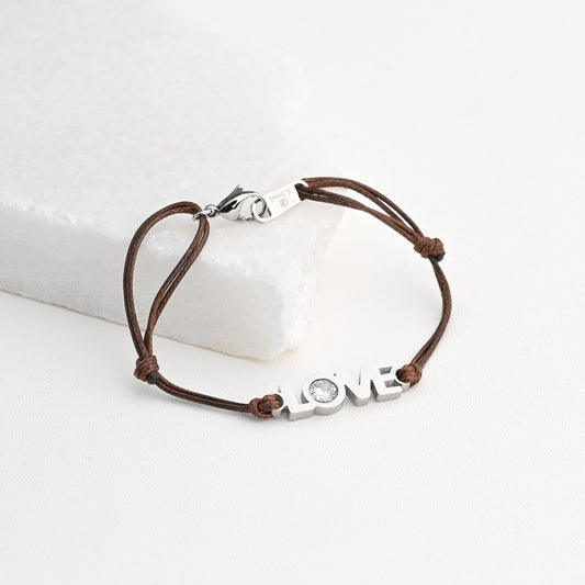 Pulsera de cuerda y acero con la palabra love y con brilli acabado plata