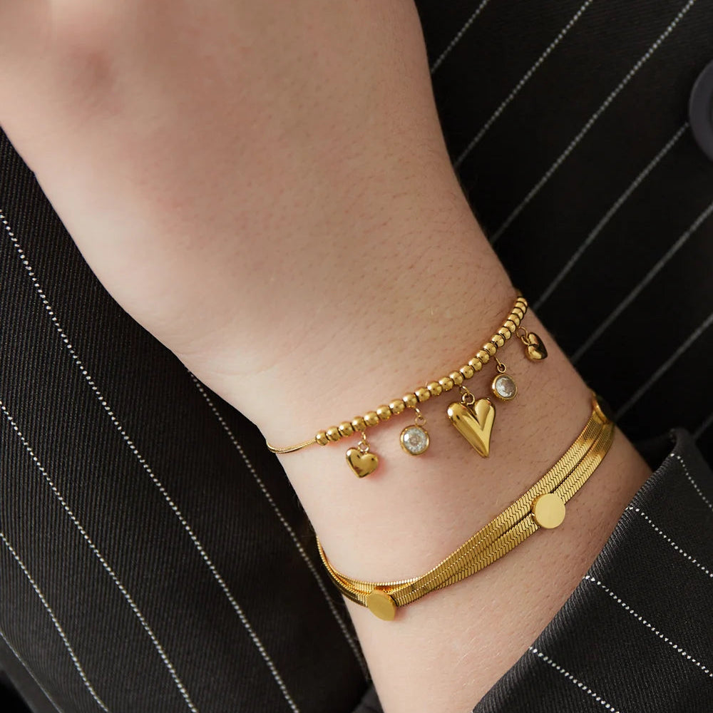 Pulsera de acero con esferas, dijes de corazones y circonitas acabado plata - Moments by You